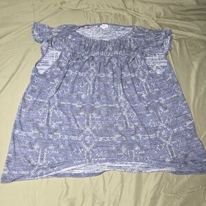 LuLaRoe Stasha ruffle top featuring flutter sleeves and a relaxed fit.